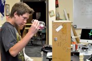 Spencer Turner, 14, examines a sample he tests for water hardness Tuesday morning at Craig Middle School. Turner signed up for the school’s River Watch program “just because it’s fun,” he said. “You get to get out of school and get to help check the rivers.”