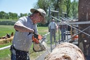 Danny Zeadker of Wauseon, Ohio, begins working on a wood sculpture Wednesday for the annual Whittle the Wood Rendezvous in Loudy-Simpson Park. He’s been wood carving for 12 years and said carvings don’t always turn out the way the artist initially envisions them. “The log always wins,” he said.