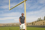 Adams State University tight end Brady Conner leans against the field goalpost at Moffat County High School. Conner, an MCHS graduate, was red-shirted in his first season at Adams State and is looking forward to getting back into game action during the fall.