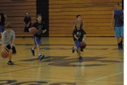 Campers at the Moffat County High School basketball camp work on dribbling and jump-stopping Tuesday during a drill at MCHS. The camp was Monday through today for boys from grades four through eight. Incoming MCHS sophomore Matt Hamilton (right) helps the players with the drill.