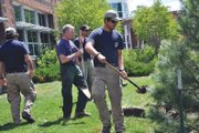 Local fire crews help plant a Ponderosa Pine on Tuesday morning in front of the Bureau of Land Management’s Little Snake Field Office in memory of Brett Stearns. The firefighter died during a hazard tree abatement project June 26, 2009, at Freeman Reservoir. He was 29.