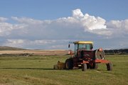 A swather sits idle at Carpenter Ranch in Hayden. The brown meadows in the background are a common sight for Yampa Valley residents during one of the worst drought years in memory for agricultural producers.