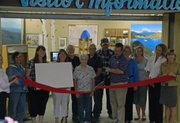 City of Craig and Moffat County elected officials join members of the Moffat County Tourism Association for a county logo unveiling Tuesday at the MCTA office in Centennial Mall. MCTA Board members have been working on a new brand for the county for more than a year.