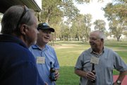 Rick Johnson, manager of Tri-State Generation and Transmission Association Inc.’s Craig Station, chats Tuesday with attendees of the Colorado Coal & Power Generation Conference barbecue at Loudy-Simpson Park. Earlier in the day, Johnson told more than 70 people at the Holiday Inn of Craig it would cost Tri-State an estimated $300 million in upgrades to comply with the Clean Air, Clean Jobs Act.