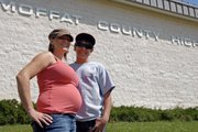 Myranda Lyons, left, and her son, Hunter Roberts, 14, stand Saturday outside Moffat County High School. Today Roberts started the next chapter in his life as a member of the Moffat County High School class of 2016.