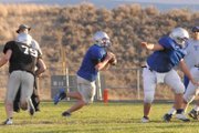Bubba Ivers, a Moffat County High School senior, looks to pass during the football team’s scrimmage against Coal Ridge High School Aug. 24 at the Bulldog Proving Grounds. Ivers, in his third year as starting quarterback, has learned a new offense for his senior season.