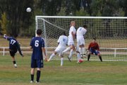 The Moffat County High School wall of defenders deflects a Rifle High School free kick during the game Tuesday at Loudy-Simpson Park. Rifle would come from behind to win, 3-2.