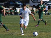 Moffat County High School junior Nestor Arrellano dribbles the ball Tuesday during boys soccer team's game against Colorado Rocky Mountain High School at Loudy-Simpson Park. MCHS lost the game, 4-3.