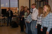 Master of Ceremonies Todd Hagenbuch gives the background of student members of the Equestrian club from Colorado Northwestern Community College's Rangeley campus. The students were auctioned off Saturday evening, during the live auction portion of the CNCC Craig campus fundraiser dinner. Students were bid on for three hours of work.