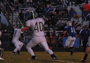 Bubba Ivers looks to juke a Delta defender in the first half of Friday night's game at the Bulldog Proving Grounds.