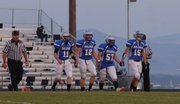 The Moffat County captains walk out onto the field for the coin toss. From left: Bubba Ives, Michael Samuelson, Zach Beachamp and Jarret Walt.