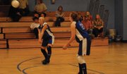 Sari Morgan prepares to bump the ball Thursday during the Craig Middle School B volleyball team's match against Meeker. The B team of seventh-graders beat Meeker in three sets, 25-18, 18-25, 15-9.