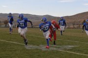 Alex Neverez (37) returns an interception in the third quarter of Saturday's Craig Middle School vs. Steamboat Springs seventh-grade football game at the Bulldog Proving Grounds. Alex would bring the pick into Sailors territory with help from a convoy of blockers, including Kaden Hafey (21).
