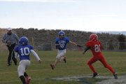 Ty McDaniel looks for space on a run during the first quarter against Steamboat Springs at the Bulldog Proving Grounds on Saturday. Ty had a touchdown run in Craig Middle School's 22-6 victory.