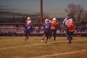 Chargers ball carrier breaks free Tuesday night at the Bulldog Proving Grounds. The Cook Chevrolet-sponsored team was taking on Anson Excavating's Broncos in the Craig Parks and Recreation Doak Walker Super Bowl. The Broncos prevailed, 32-28.
