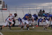 Kody Fief carries the ball during Tuesday's Moffat County-Steamboat Springs C football game. Fief was a force on defense for the Bulldogs in the game, recording five sacks.