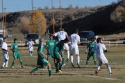 The ball caroms away from the head of Kelley Campbell (37), who headed it in off a corner kick to give Moffat County a 2-1 lead Thursday at Loudy-Simpson Park.