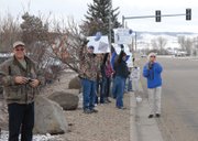 Moffat County students and parents cheer on the high school cross country team as it leaves for the state meet Friday morning.