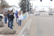 Moffat County parents and students cheer on the cross country team Friday morning at Finley Lane and Victory Way, as the team leaves for the state cross country meet in Colorado Springs.