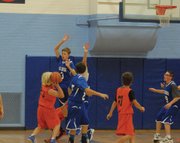 Kasen Brennise, No. 3, goes up to contest a Hayden shot during the seventh-grade game between Craig Middle School and Hayden on Saturday morning at CMS.