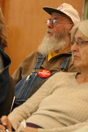 Craig resident Bob Grubb listens to a response from Sue Birch, Executive Director of Health Care Policy and Financing for the State of Colorado, to his question about rumors of death panels under health care reform in a presentation Friday at the Craig City Council Chambers.