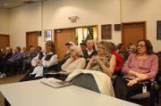 Members of the audience listen to a response during a question and answer session from Susan Birch, Executive Director of Health Care Policy and Financing for the State of Colorado during a seminar on health care reform Friday at the Craig City Council Chambers.