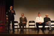 Guy Bradshaw, left, addresses Moffat County High School students Friday morning in the auditorium during a Veteran's Day celebration.
