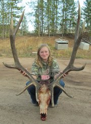 Kendra Halder poses with the antlers from the bull she killed in GMU 15 during the second elk hunting season this year. Halder has been hunting for two years.