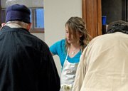 Craig resident Brenna Knez was one of two dozen volunteers Thursday who helped serve community members during the third annual Thanksgiving dinner at the St. Michael's Catholic Church Community Soup Kitchen. Like Brenna, many of the volunteers were children and teenagers.
