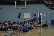 Head coach Eric Hamilton speaks with all the players going out for boys basketball before practice in the Moffat County High School gym. Hamilton is starting his second year at the helm of the Bulldogs, and looking to continue the program's improvement.