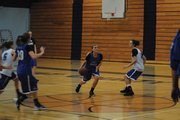 Jazmine Swindler (center) drives toward the basket during girls basketball practice at the Moffat County High School gym. Swindler is one of several juniors who will add depth to a talented and senior-heavy girls roster.