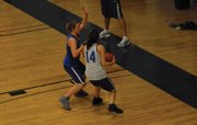 Lauren Samuelson (in blue) defends Brittany Walker (14) as she looks for a shot during a one-on-one drill at Moffat County girls basketball practice.