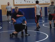 Jesse Demoor (facing the camera) goes through a drill with a teammate at MCHS wrestling practice Nov. 19. Demoor will wrestle in either the 170 or 182-lb class this season, and had a strong summer at wrestling camp, going 15-5.