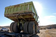 A Euclid 302LD Dump Truck prepares to be unloaded Tuesday at the Wyman Museum. Known as Truck 711, the Euclid was one of 11 operated during the early years of Trapper Mine.