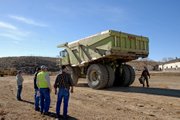 A Euclid 302LD Dump Truck is unloaded Tuesday near its new home on the south side of the Wyman Museum. The truck, recently retired and donated to the museum by Trapper Mine, hauled more than 1,344,000 tons of coal and ash during its 20 years of service at Trapper Mine.