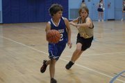 Lane Gonzales, an eighth-grader at Craig Middle School, beats his defender on a drive to the basket Tuesday evening at CMS. The B team lost the game, 40-27.