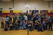 Sandrock Elementary School students stand with principal Kamisha Siminoe. Students who sold 20 items during the school fundraiser had the opportunity to spray Siminoe with silly string.