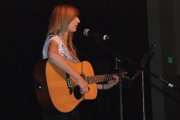 Moffat County HIgh School freshman Paige Durbin performs a song on her guitar Thursday afternoon during rehearsals for the MCHS talent show.