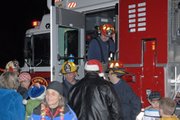 Craig Fire/Rescue firefighters deliver toy donations Thursday night during day two of the annual KRAI/55 Country Holiday Drive. More than 1,700 toys were donated during the event, which will benefit Christmas for Kids.