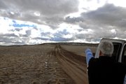 Dan Rast points out where he, and Moffat County Sheriff's Office deputies, suspect the shooter was standing when his son, Tyler, was struck in the arm by a stray bullet. Sheriff's Office deputies are investigating the incident as an accident, but have not yet been able to locate any suspects.