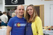 Chief Petty Officer in the United States Navy Travis Doolin, left, and his wife, Tisha Doolin, pose for a picture Monday night at the VFW Christmas dinner, where Doolin was the guest of honor.