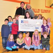 Hayden Valley Elementary School kindergarten teacher Laura Voorhees and her class pose with a check from the Peabody Energy Leaders in Education program. Peabody Energy Colorado Director of Human Resources Scott Harrell and Peabody Energy Leaders in Education Program Manager Maureen Moore, both in the back row, joined the class for the photograph.