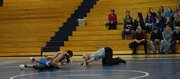 Ricardo Malta of Grand Valley pins Shandon Hadley during their match Thursday night at Moffat County High School. The Cardinals beat the Bulldogs, 39-30.
