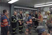 Employees of Twentymile Mine receive bonus checks from executives from St. Louis-based Peabody Energy. Twentymile Mine received Peabody's 2012 President's Safety Award. It was the third time since 2005 Twentymile received such distinction.