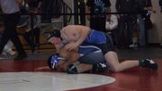 Jesse Demoor works for a pin at the Colorado 3A Region 1 wrestling meet. Demoor would get the pin late in the third round and will begin Saturday's wrestling in the semifinals of the 182-lb class.