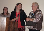 Lois Wymore, right, accepts her award as the Craig Chamber of Commerce's 2012 ambassador of the year from Shannon Moore, left, and Adrianna Robbins.