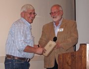 Dave Satterwhite, left, of Brothers Custom Processing accepts the award for small business of the year from Craig Chamber of Commerce Chairman Jeff Smith.