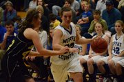 Kori Finneman tries to beat her defender from Jefferson Academy Friday in Craig. Finneman led Moffat County with 19 points as the Bulldogs advanced to the Sweet 16 with a 53-40 win.