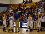 Head coach Matt Ray congratulates his team after its win over Jefferson Academy Friday in Craig, while the home crowd cheered the Bulldogs on. The 53-40 regional semifinal win set up a game between Moffat and Kent Denver Saturday at 1 p.m. in Craig.