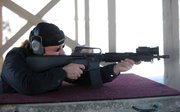 Gun owner Bob Reese fires his AR-15 rifle, which uses a 30-round clip, at the Routt County Rifle Club on Tuesday afternoon. New legislation in Colorado expected to be signed into law Wednesday would limit new gun magazines to a maximum of 15 rounds.